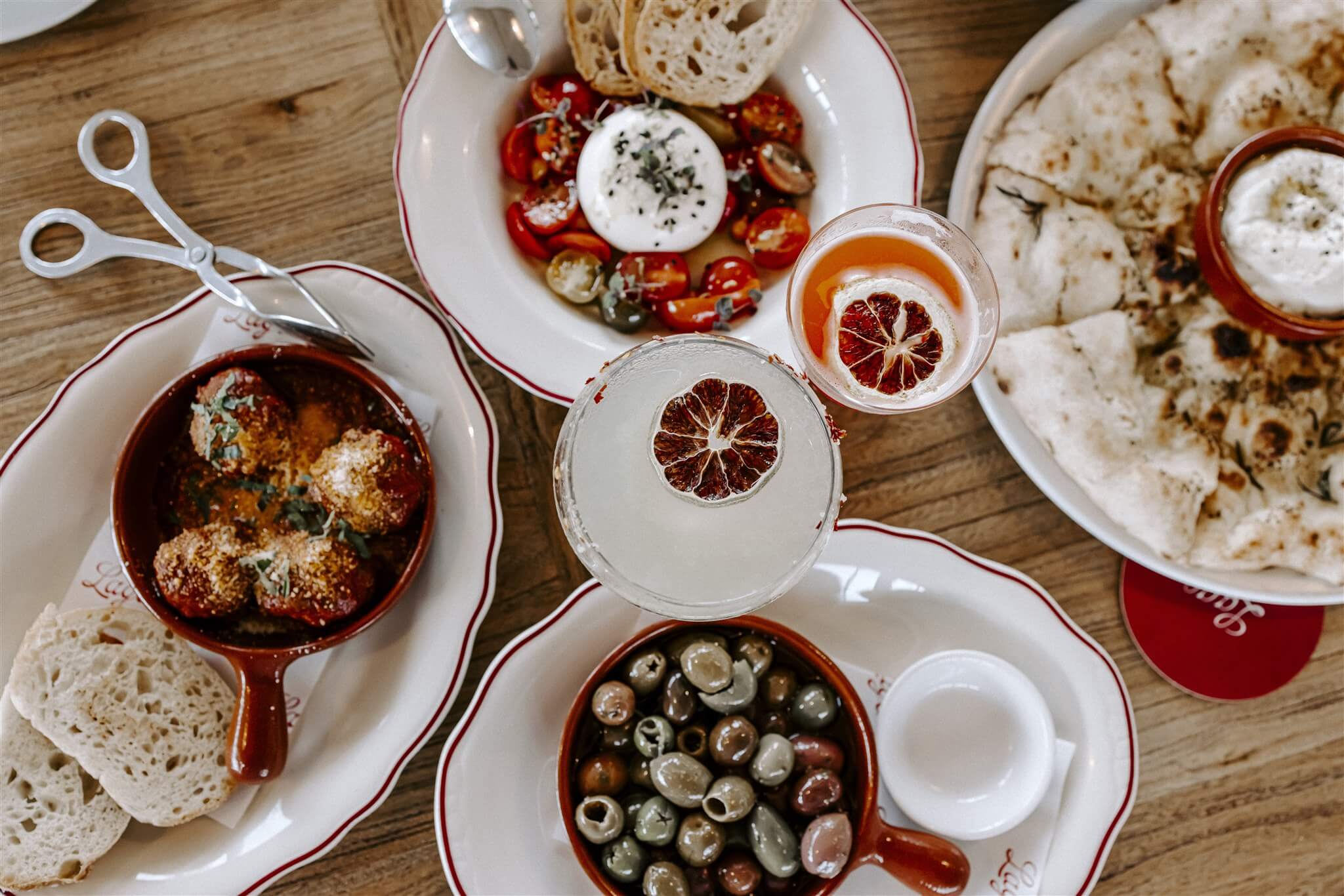 plates of food with cocktails in the centre