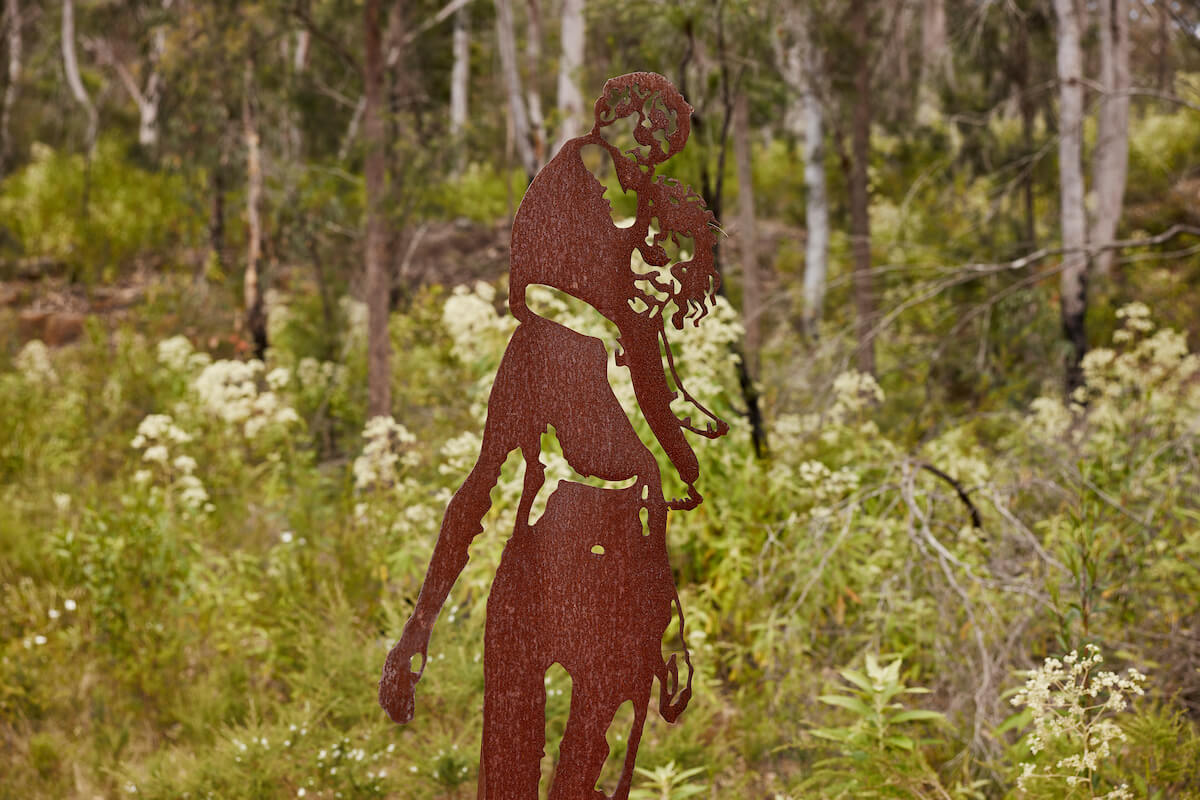 Aboriginal parent with child metal sculpture located along the old great north road route