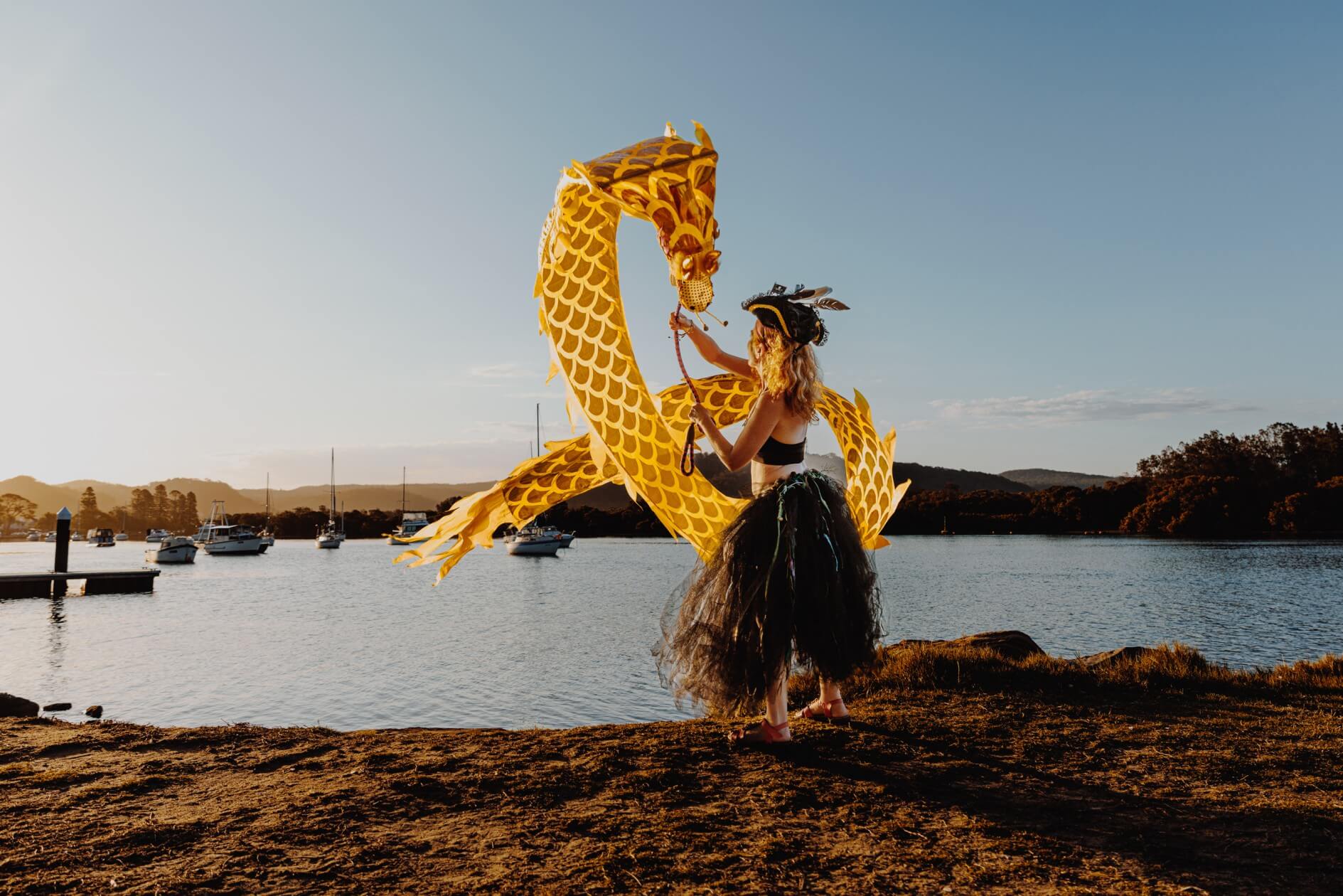 Lady with a yellow dragon puppet