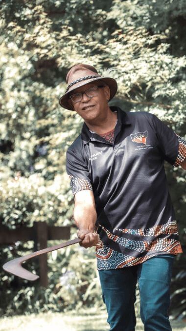 aboriginal elder throwing boomerang