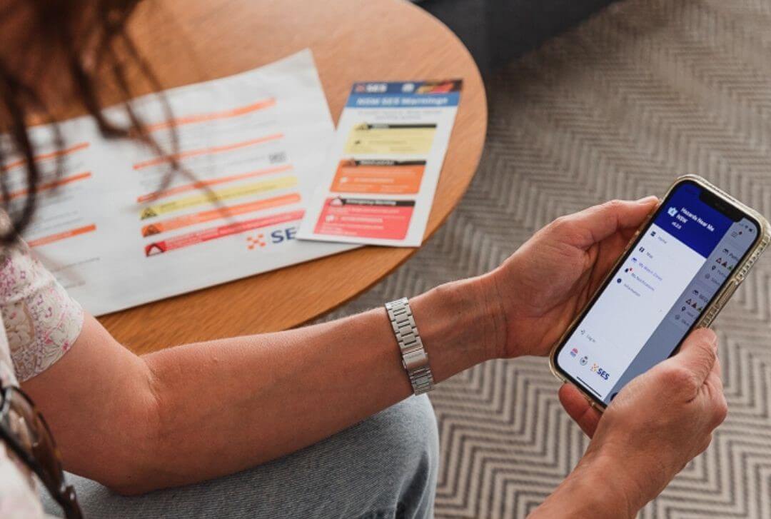 person accessing useful hazard detection app on their phone