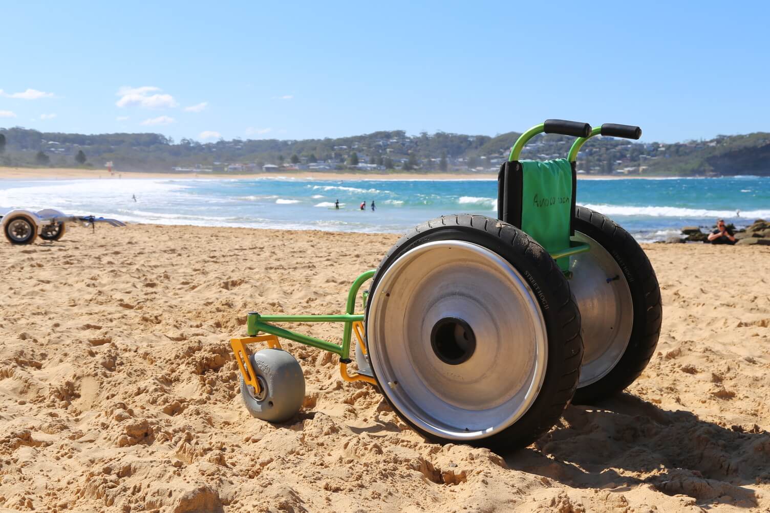 A beach wheelchair on the sand