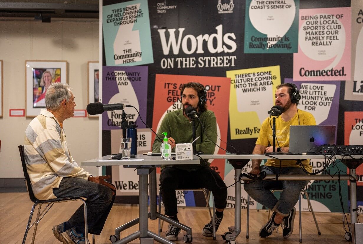 People talking over community radio - Words on the Street station