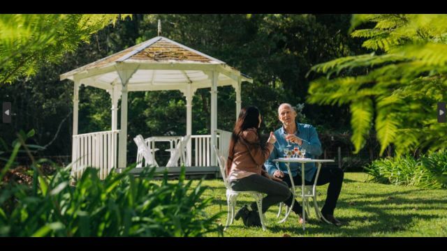 couple sipping botanical wine in tranquil garden