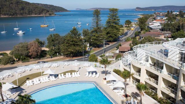 aerial view of mantra hotel accommodation next to broken bay