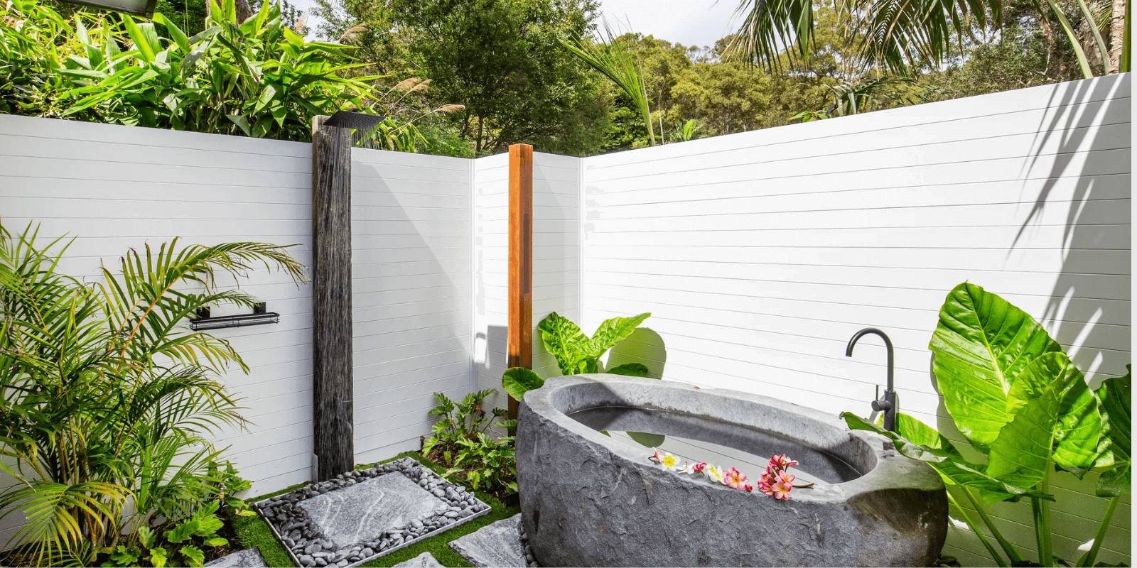 Stone bath in tropical oasis, Umina Beach