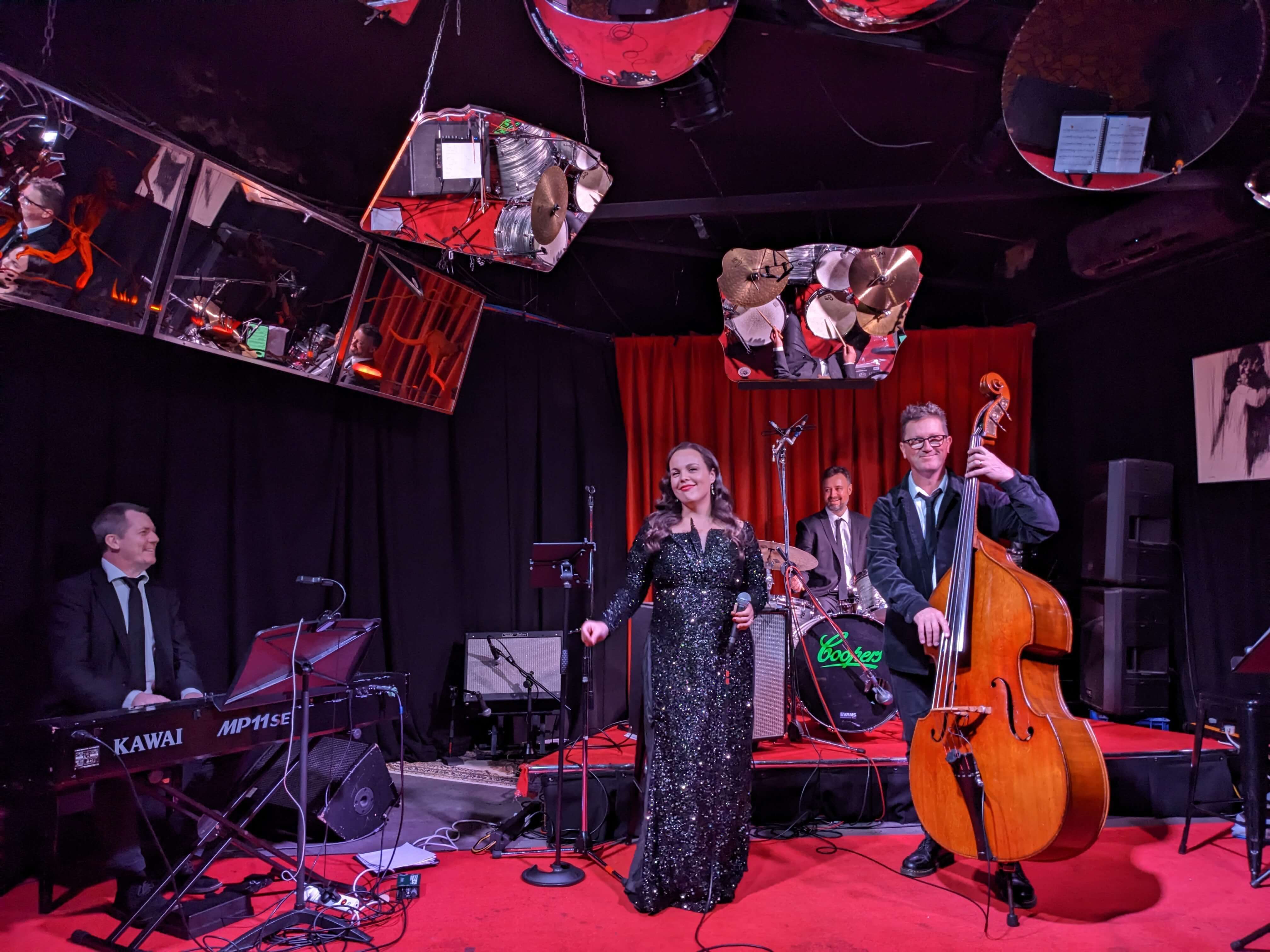 Jazz players in a red and purple room