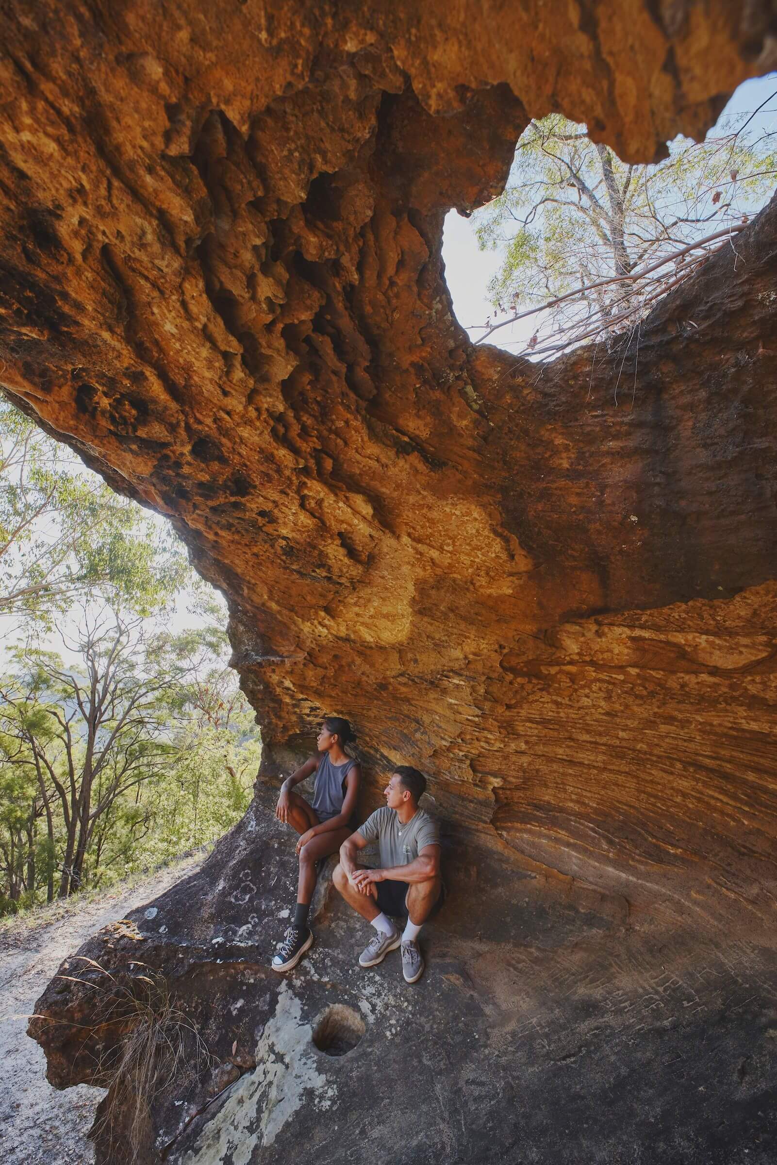 two hikers take a rest in hangmans rock