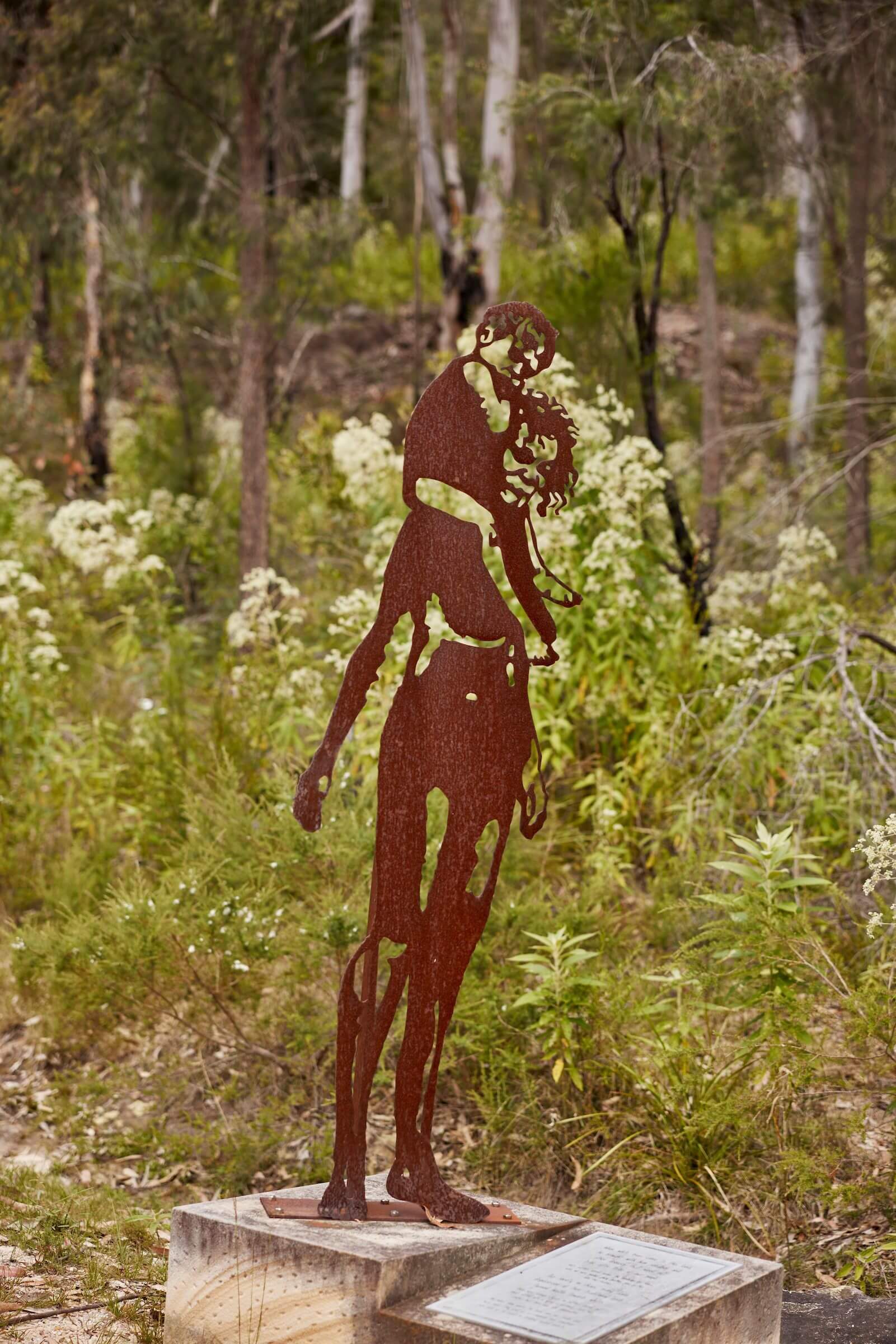 metal sculpture of traditional aboriginal woman on the walk