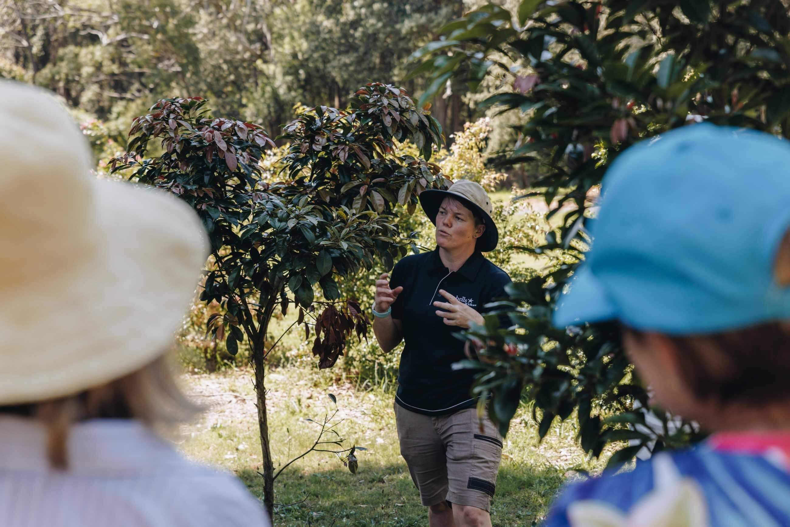 head horticulturalist giving a garden site tour to visitors