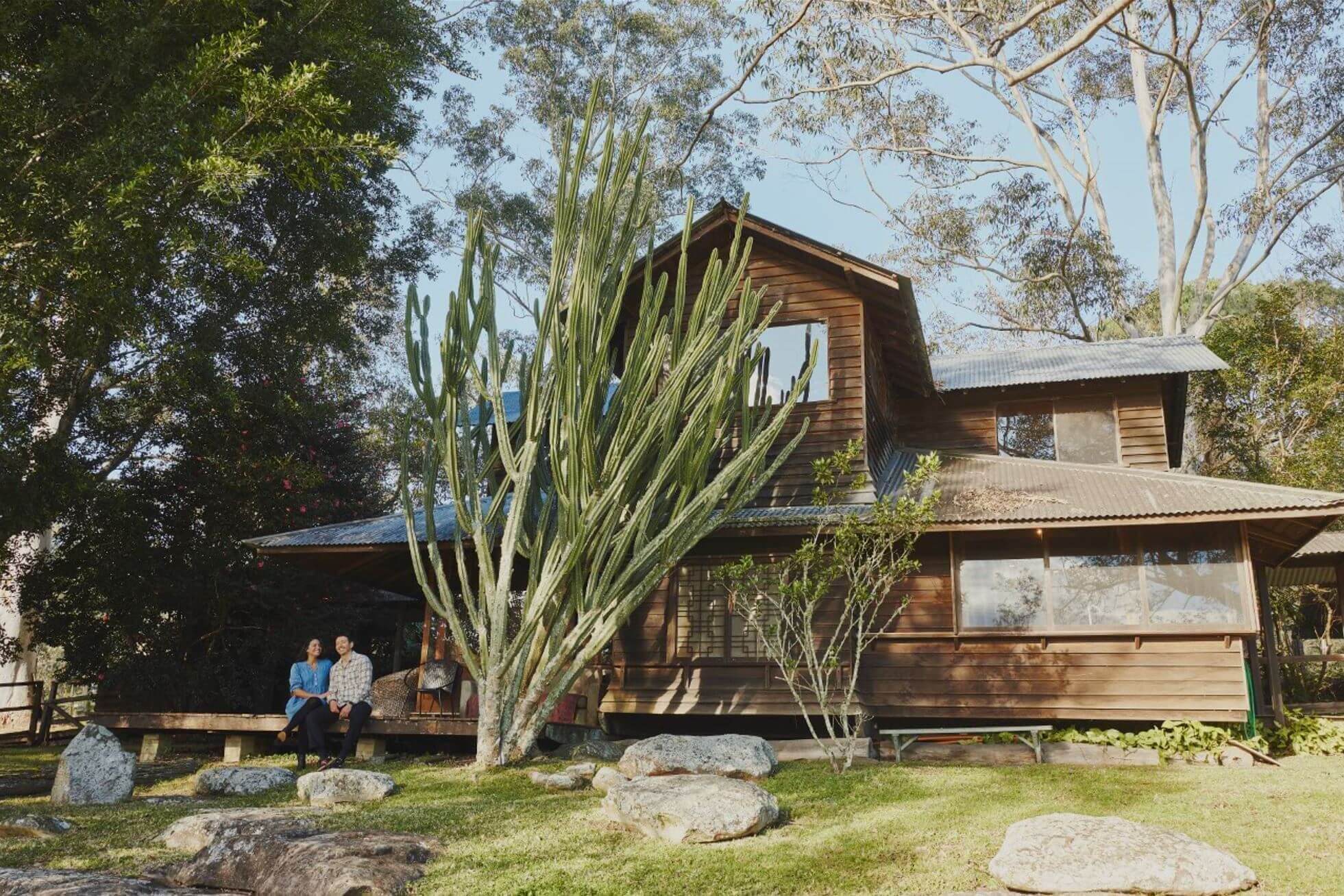 Wooden Farmhouse with large cacti 