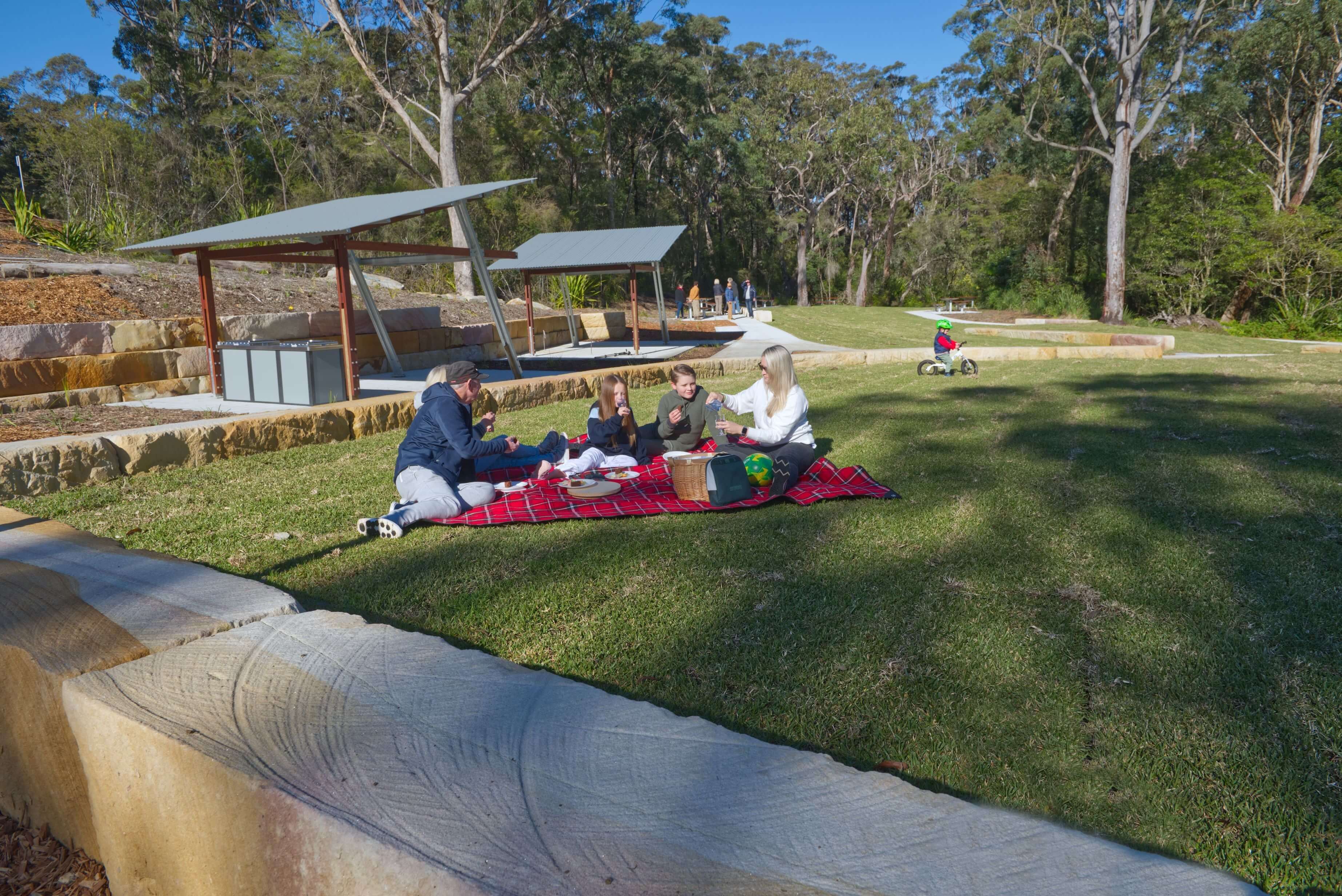 people having an outdoor picnic at Somersby Falls visitor precinct