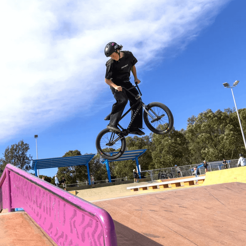 bmx biker jumping at Umina Beach skate park 