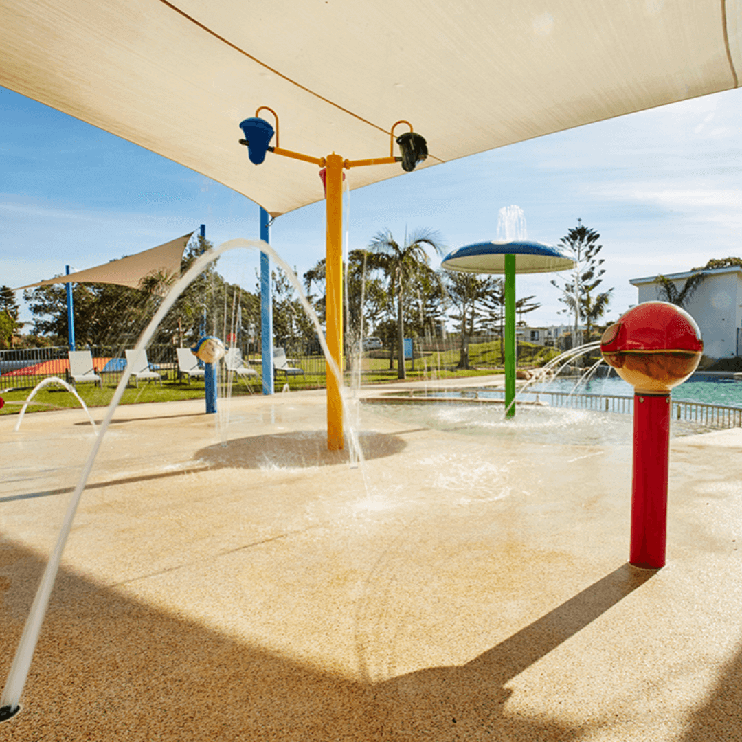 A water park fit with tipping buckets and water fountains