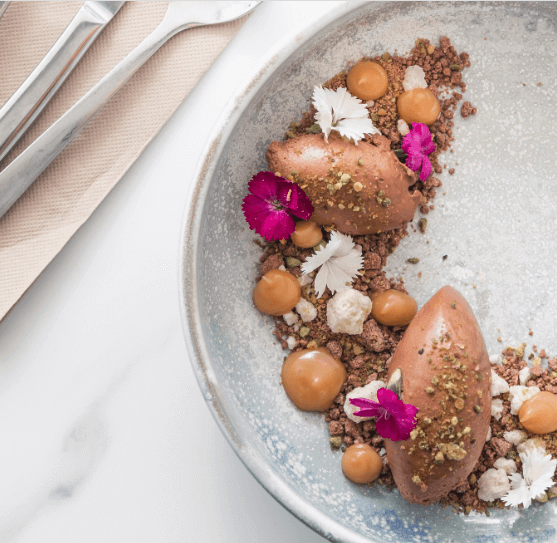 Chocolate mousse decorated with flowers 