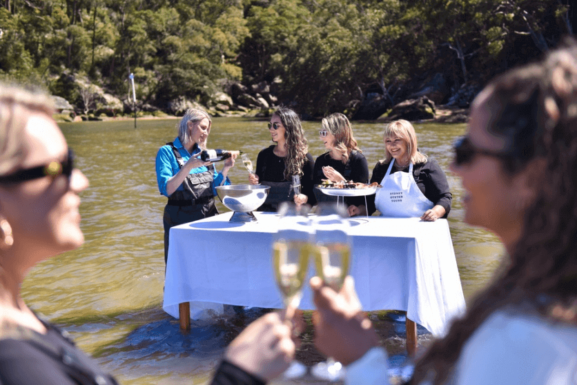 ladies eating oyster in the Hawkebury River 