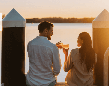 Couple at the Beachcomber resort at sunset by Remy Brand x Destination Central Coast