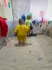 Children taking part in a large art work