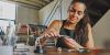 A focused woman meticulously crafting a beautiful piece of jewellery