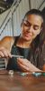 A focused woman meticulously crafting a beautiful piece of jewellery