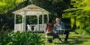 Couple sitting in the garden at Firescreek Botanical Winery, Holgate, Central Coast, NSW