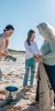 team of take 3 cleaning up a local beach of litter