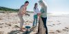 team of take 3 cleaning up a local beach of litter