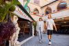 A couple walking through a Mediterannean style building