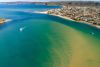 A bay of water with hues of blue and green